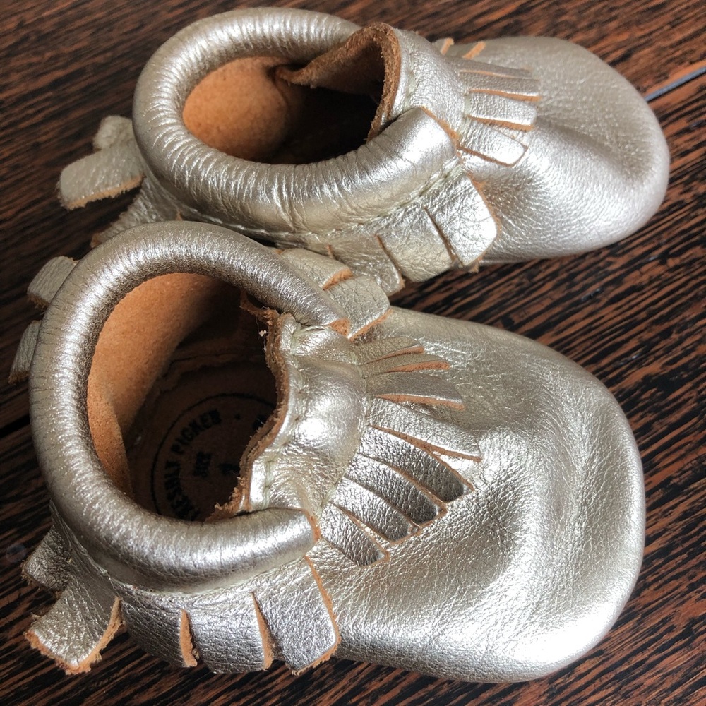 Freshly Picked gold fringe moccasins.